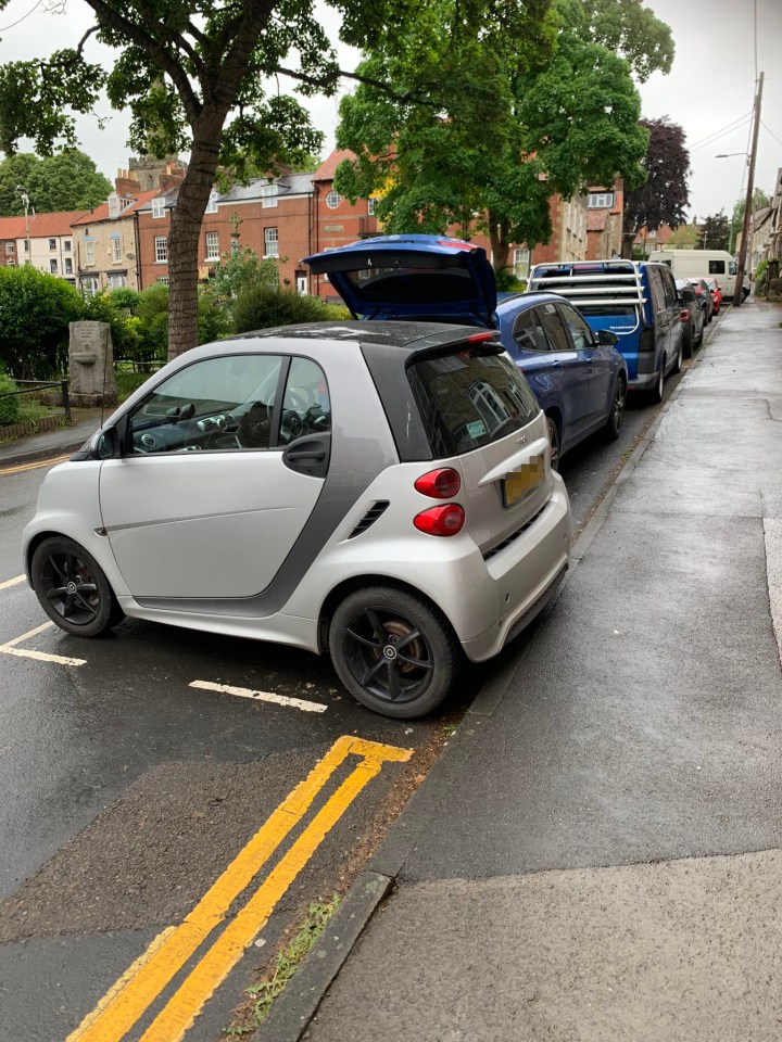Story from Jam Press (Smart Car Parking) Pictured: The cheeky parking trick where a smart car parked sideways in a roadside bay. Smart or not? Motorist divides opinion with cheeky parking trick A Smart car driver has divided opinion with a cheeky parking trick. The silver mini motor was spotted sideways in a roadside bay. The 2014 Smart Fortwo Grandstyle is just 2.6m long - about half the length of average cars. The driver parked it at right angles to the other vehicles using the street parking. Local Tony Chopping spotted it in Middleton, North Yorks. He said: “Absolutely 10/10 for parking, legend.” Many others agreed, as reported by What’s The Jam. Lauren Woodward stated: “That’s the point of Smart cars!” John Durrell said: “I’m not even mad, I’m impressed.” Wayne Jennings added: “Smart cars were designed to be able to park this way.” Balthazar Fitz said: “Legend, this guy or girl is bang inside the lines. “Ten out of ten deserves credit not criticism.” Doug Walston added: “This is the only reason to own one of these claustrocars.” Simon Jobson said: “This is what the car was made for.” Yet Colin Saunders stated: “Smart car, dumbass driver.” Back in 2014, a woman was slapped with a £50 parking fine due to her parking her car in similar fashion. The driver was given the fine by Gloucestershire County Council and spent a year trying to get it revoked. The £50 fine was then cancelled after an adjudicator stated no road regulations were broken. ENDS