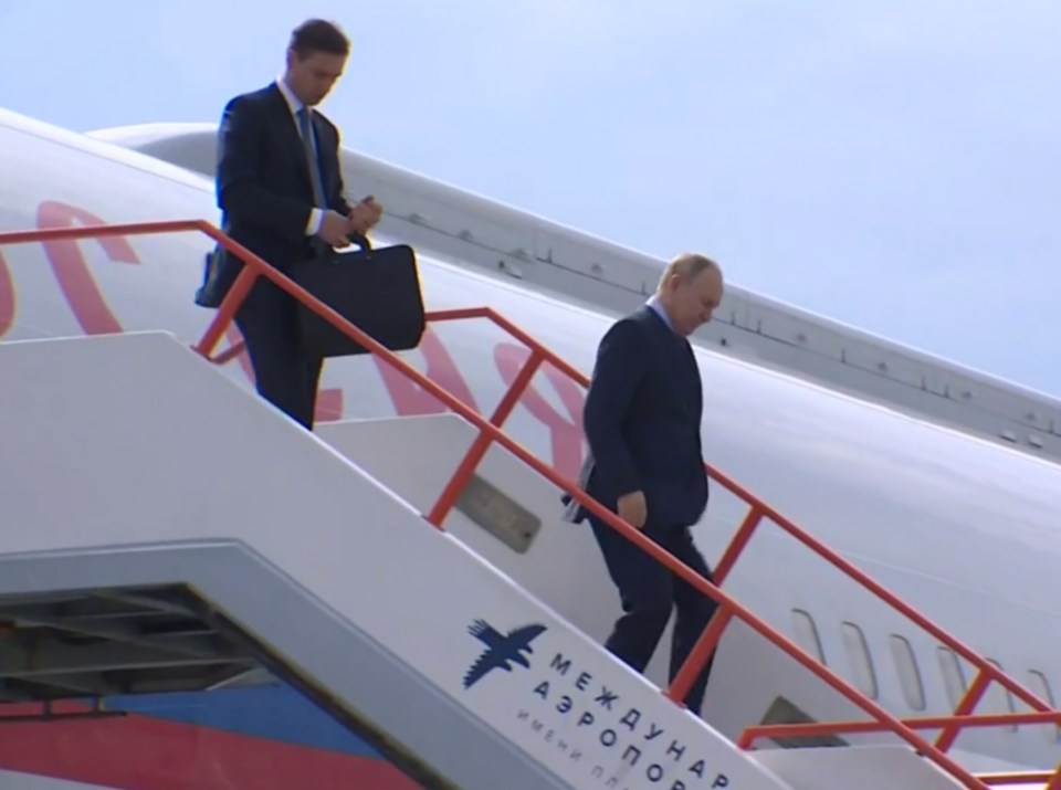 Vladimir Putin en route to North Korea arrives in Russia's largest region evidently with a flunky carrying his nuclear briefcase or a fold-up shield to protect him from assassins.