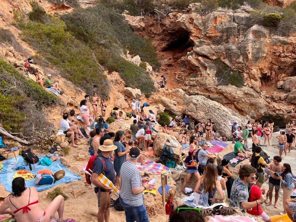 Hoards of locals took up every inch of the tiny cove by laying their beach towels