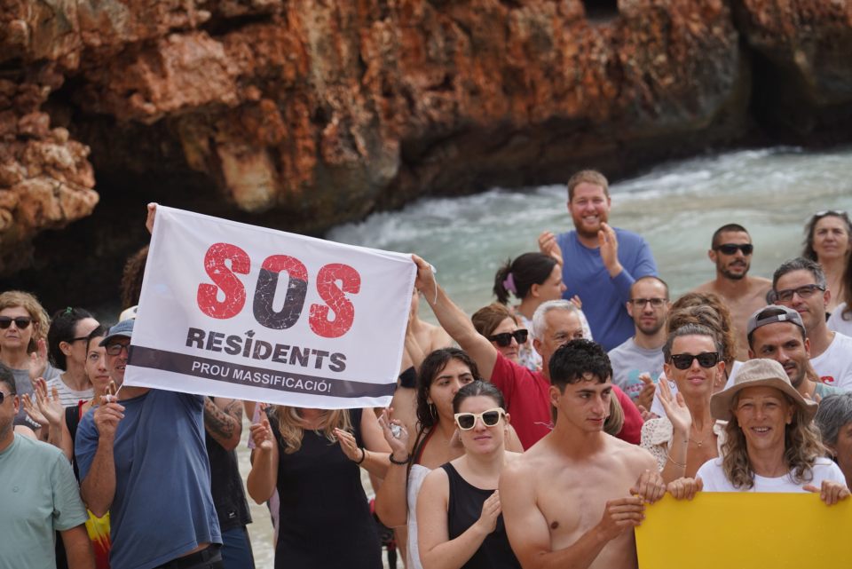 Protesters in Calo des Moro displayed SOS banners during the demonstration