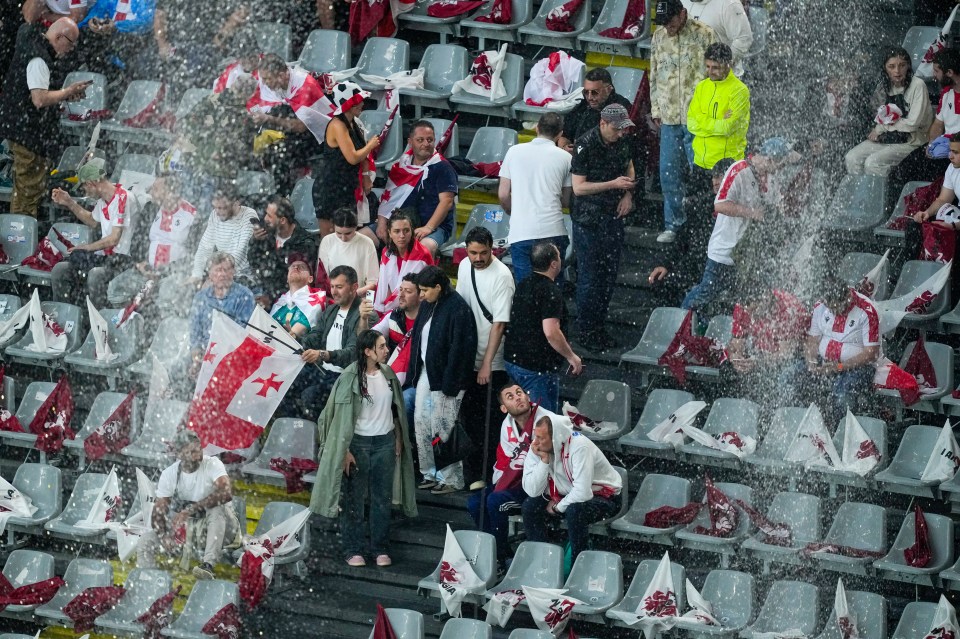 Heavy rain and the leaky roof covered fans inside the ground