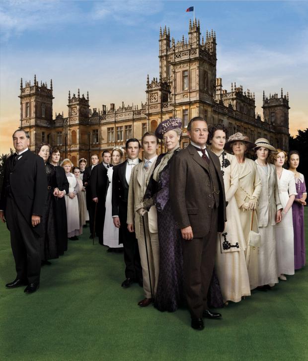 Downton Abbey cast in front of the abbey.