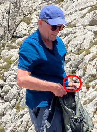Michael Mosley is pictured for the last time on the beach before heading off with a watch on his wrist