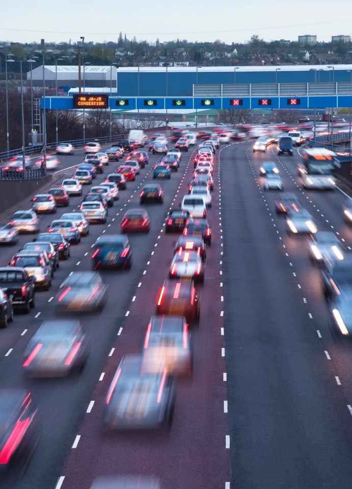 Busy urban motorway, traffic queues leaving Birmingham on the A38(M)just south of and the M6 intersection at Spaghetti Junction.