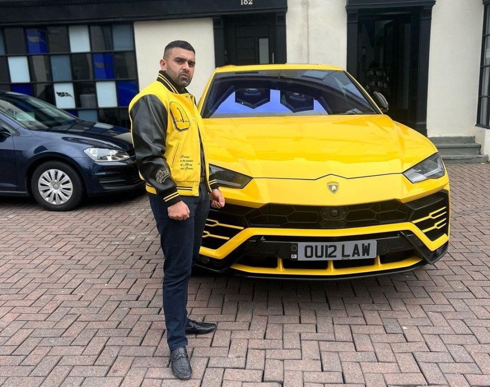 a man stands in front of a yellow lamborghini in front of maurice andrews solicitors