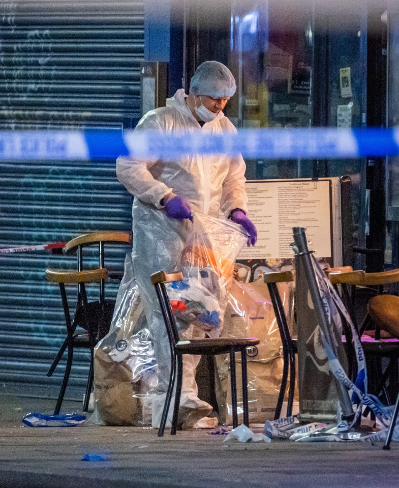 Forensic officers gather evidence at the scene of a nine-year-old's shooting amid a gangland feud