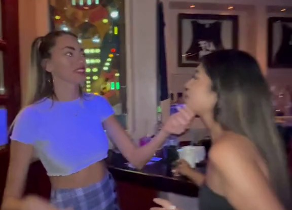 Party-goers having shots in a bar in the holiday hotspot