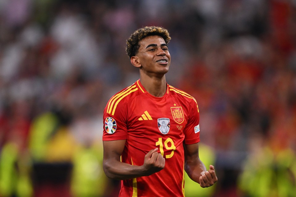 a soccer player wearing a red jersey with the number 19 on it