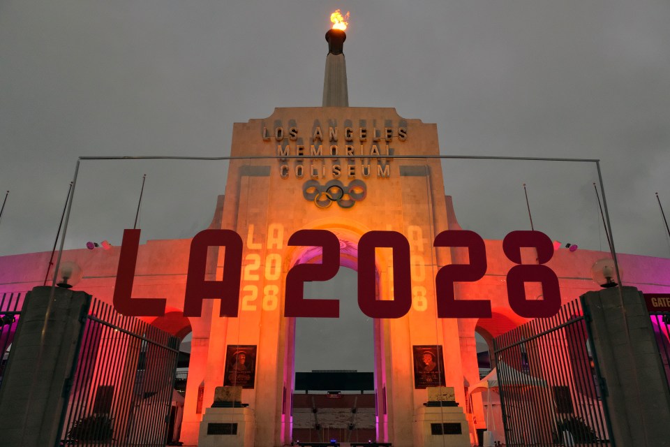 la2028 is displayed on the front of the los angeles memorial coliseum