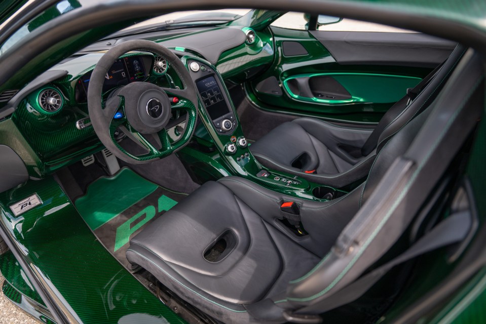 the interior of a green mclaren p1 car