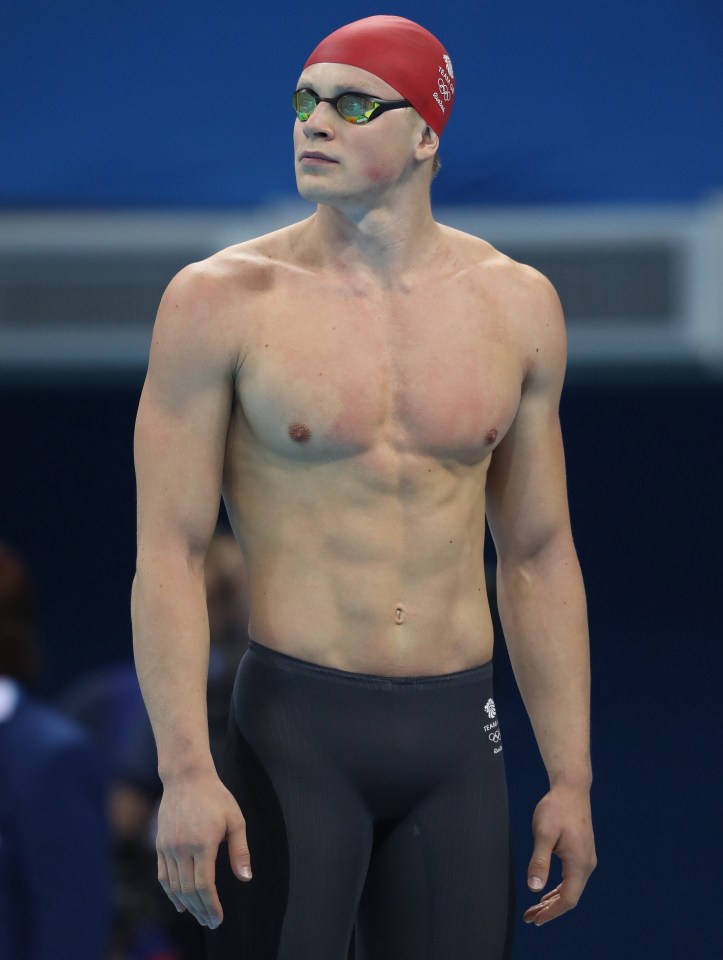 a swimmer wearing a red cap that says ' russia ' on it