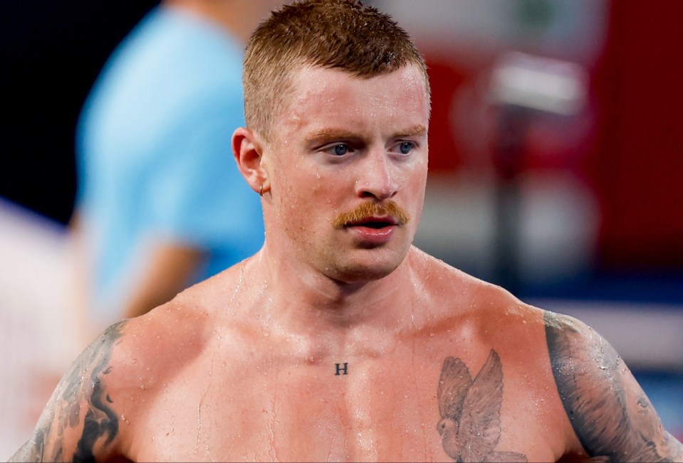 a man with a tattoo on his chest that says h