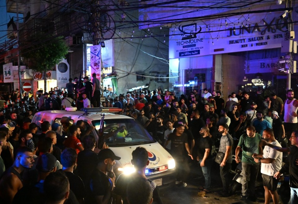 BEIRUT, LEBANON - JULY 30: Security forces and healthcare teams arrive at the site after an explosion caused by an Israeli airstrike, where a drone fired three missiles in the Dahieh area of Beirut., the capital of Lebanon, on July 30, 2024. The attack targeted multiple buildings on busy streets in Dahieh. (Photo by Houssam Shbaro/Anadolu via Getty Images)