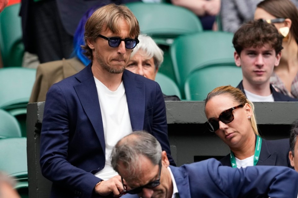 Luka Modric watches Carlos Alcaraz of Spain play Daniil Medvedev of Russia during their semifinal match at the Wimbledon tennis championships in London, Friday, July 12, 2024. (AP Photo/Kirsty Wigglesworth)