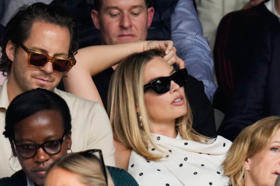 Margot Robbie watches the semifinal match between Carlos Alcaraz of Spain and Daniil Medvedev of Russia at the Wimbledon tennis championships in London, Friday, July 12, 2024. (AP Photo/Kirsty Wigglesworth)