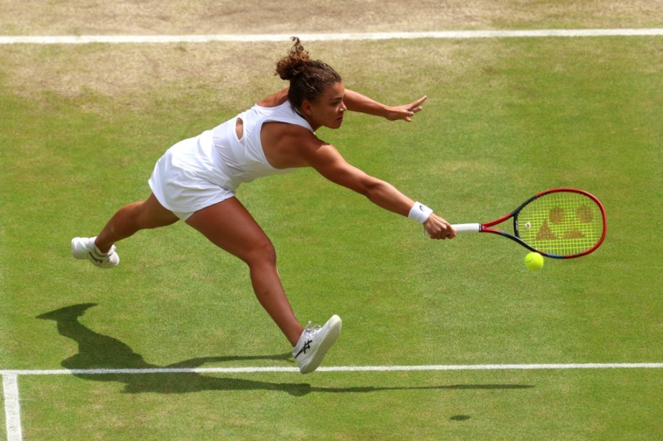 LONDON, ENGLAND - JULY 13: Jasmine Paolini of Italy plays a backhand against Barbora Krejcikova of Czechia during her Ladies' Singles Final match during day thirteen of The Championships Wimbledon 2024 at All England Lawn Tennis and Croquet Club on July 13, 2024 in London, England. (Photo by Sean M. Haffey/Getty Images)