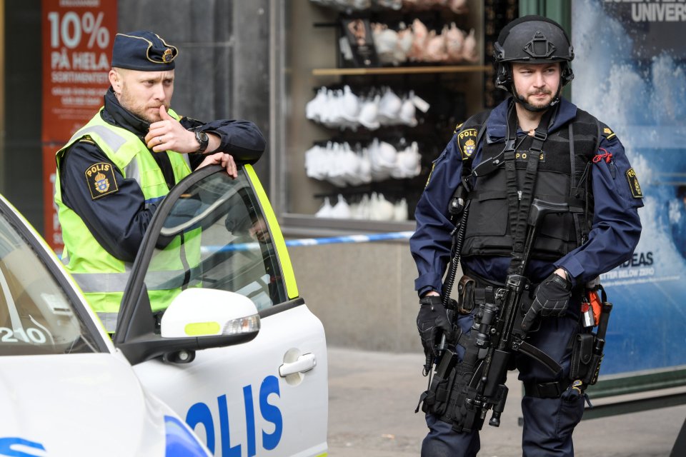 STOCKHOLM 2017-04-08 Police in central Stockholm near the crime scene on April 08, 2017, the day after a hijacked beer truck plowed into pedestrians on Drottninggatan and crashed into Ahlens department store on Friday, killing four people, injuring 15 others. TT News Agency/Anders Wiklund/via REUTERS ATTENTION EDITORS - THIS IMAGE WAS PROVIDED BY A THIRD PARTY. EDITORIAL USE ONLY. SWEDEN OUT.