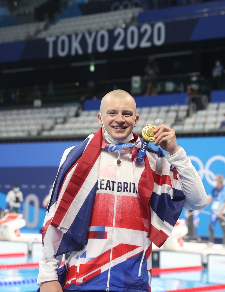 Swimmer Adam Peaty with his gold medal from Japan