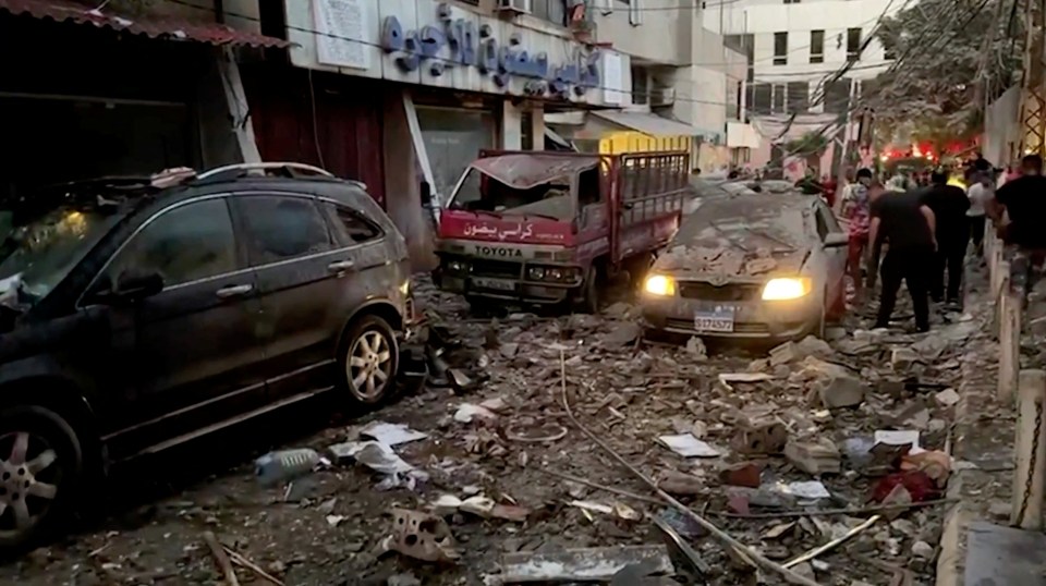 a toyota truck is parked next to a car