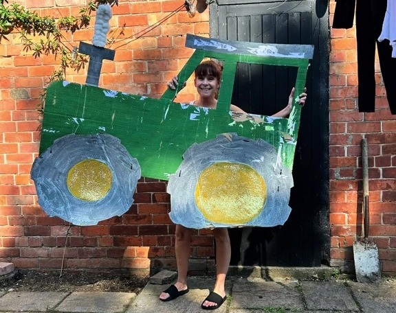 Even mum Victoria had a turn posing with her daughter's pretend vehicle