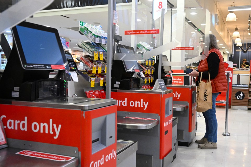 A checkout terminal hit by IT issues is seen at a Coles store in Canberra, Australia