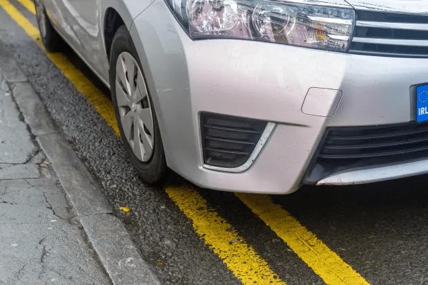 You cannot park on double yellow lines at any time