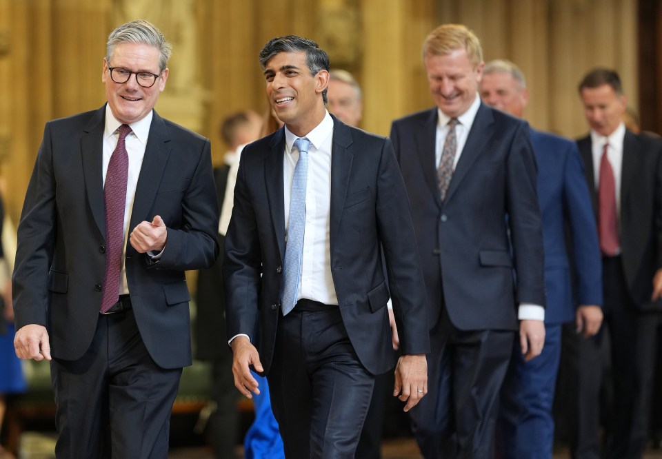 a group of men in suits and ties are walking together