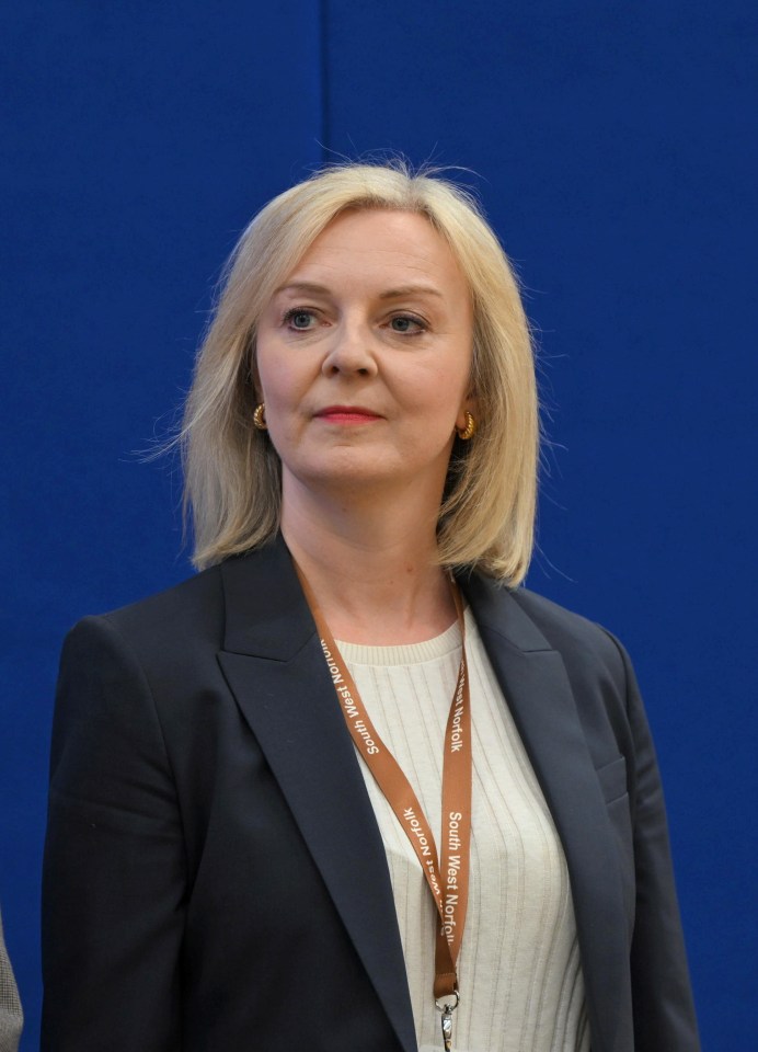 a woman wearing a lanyard that says south west media