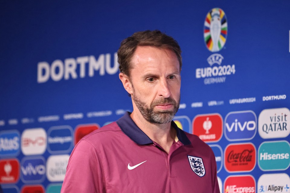a man stands in front of a euro2024 sign