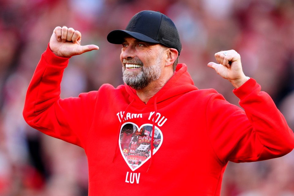 a man wearing a red hoodie that says thank you luv