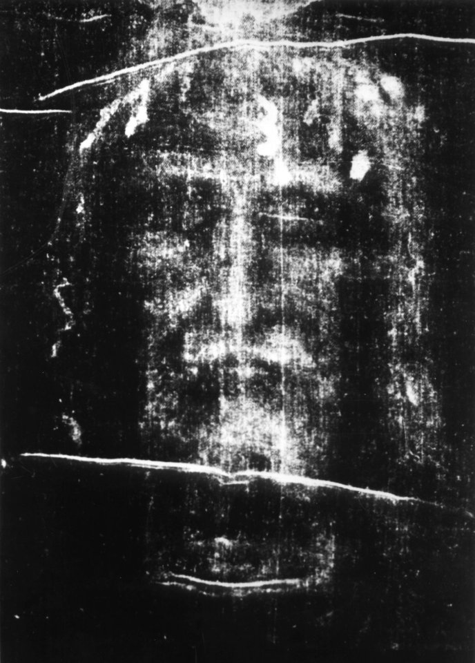 a black and white photo of jesus ' face