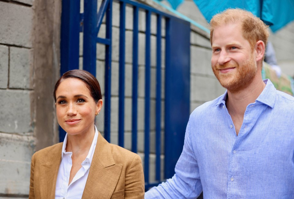 a man and a woman are standing next to each other and smiling