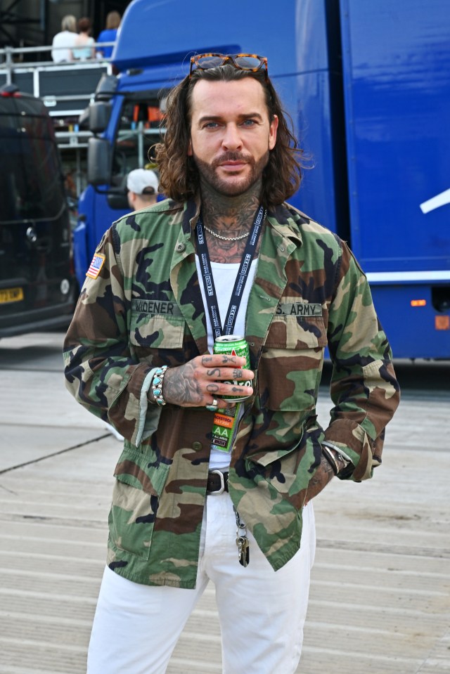 a man wearing a camo jacket with the name widener on it