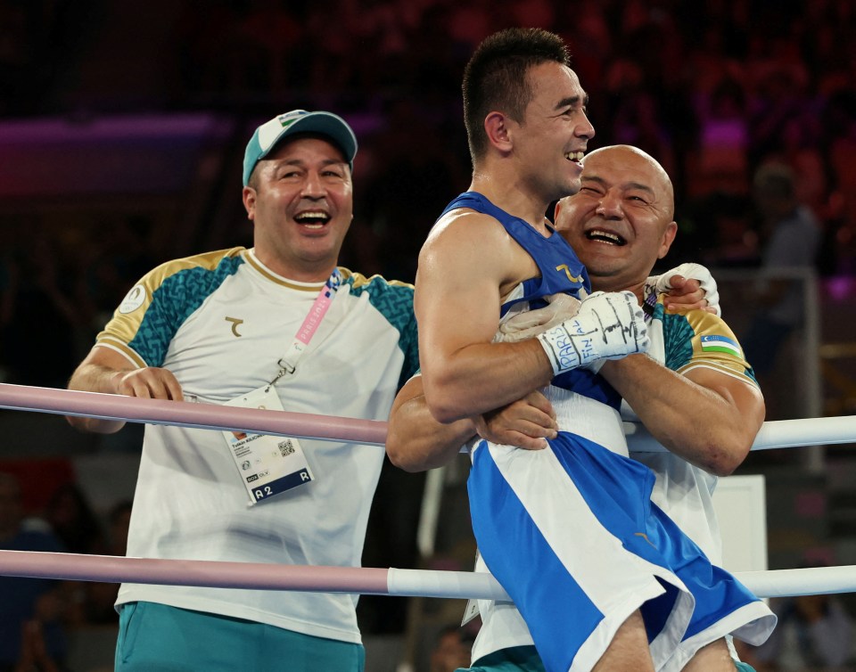 a man wearing boxing gloves that say ' tokyo 2020 ' on them