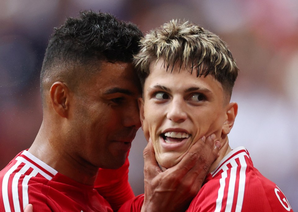 two soccer players one of whom has the letter g on his jersey