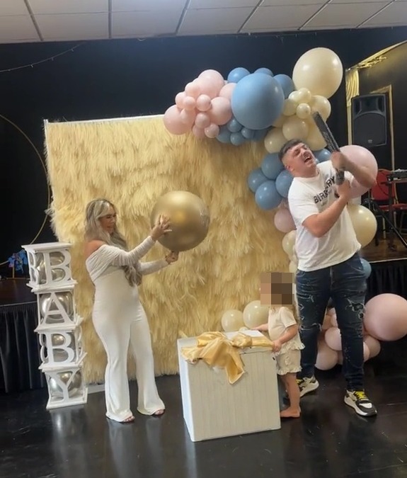 a baby shower with balloons and a sign that says baby