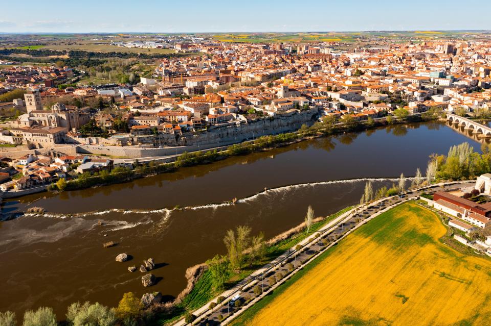 an aerial view of a city and a river
