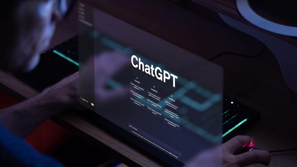 a man is using a computer with chatgpt on the screen