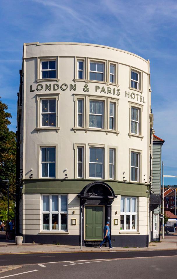 a white building with the words london & paris hotel on it