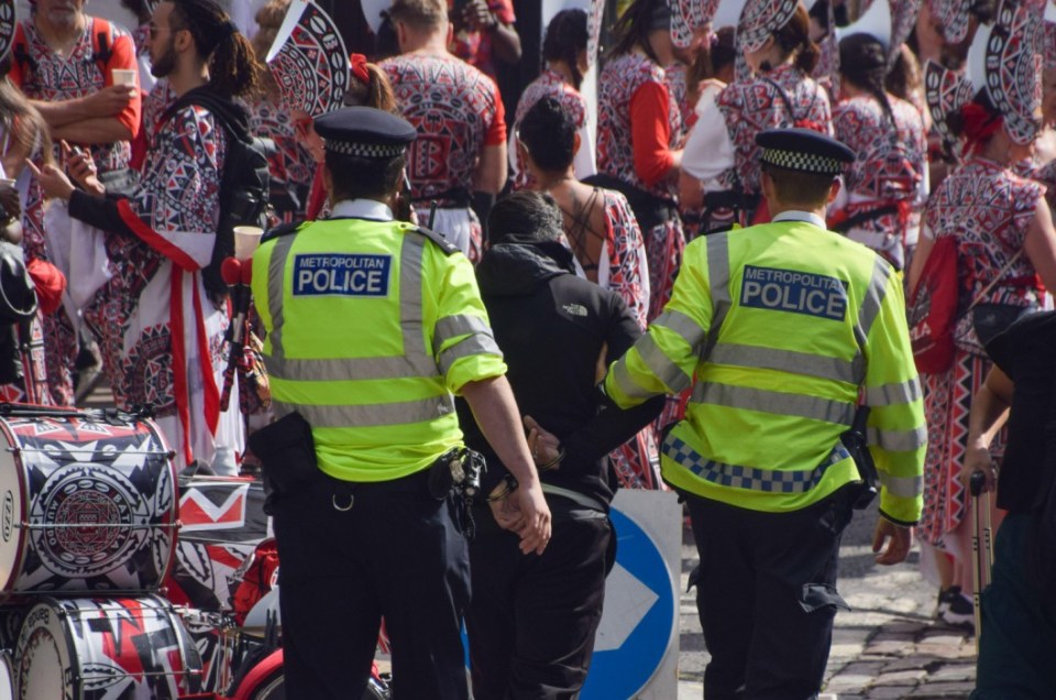 Alamy Live News. 2XXW2YC London, England, UK. 26th Aug, 2024. Police officers arrest a man on the second day of the Notting Hill Carnival as security is increased following stabbings and arrests on the previous day. (Credit Image: Â¿ Vuk Valcic/ZUMA Press Wire) EDITORIAL USAGE ONLY! Not for Commercial USAGE! This is an Alamy Live News image and may not be part of your current Alamy deal . If you are unsure, please contact our sales team to check.
