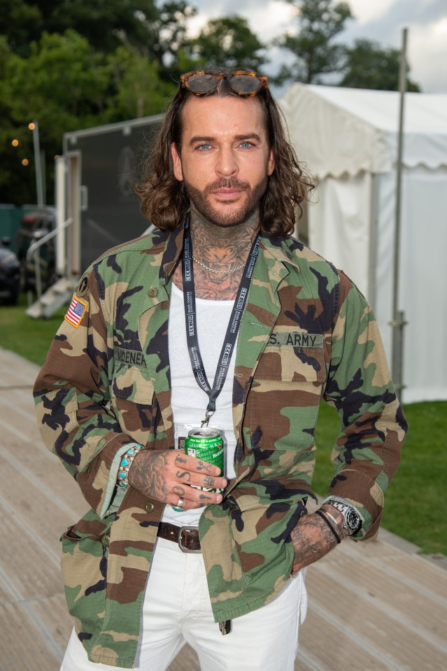 a man wearing a camo jacket with the word army on it