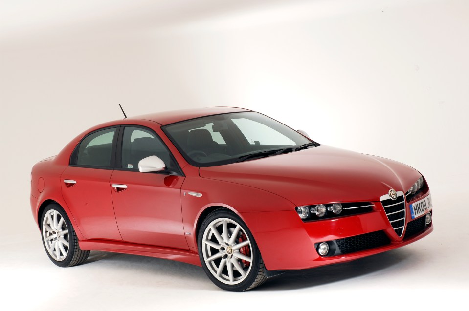 a red alfa romeo is parked on a white background
