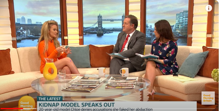 a woman sits on a couch on a good morning britain show