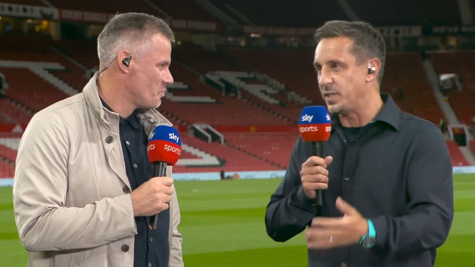 two men on a soccer field with microphones that say sky sports