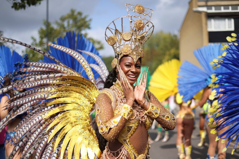 A samba dancer poses for a photo during the Notting Hill Carnival, in London, Britain, August 26, 2024. REUTERS/Hollie Adams