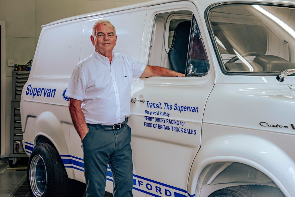 a man leans against a white van that says supervan