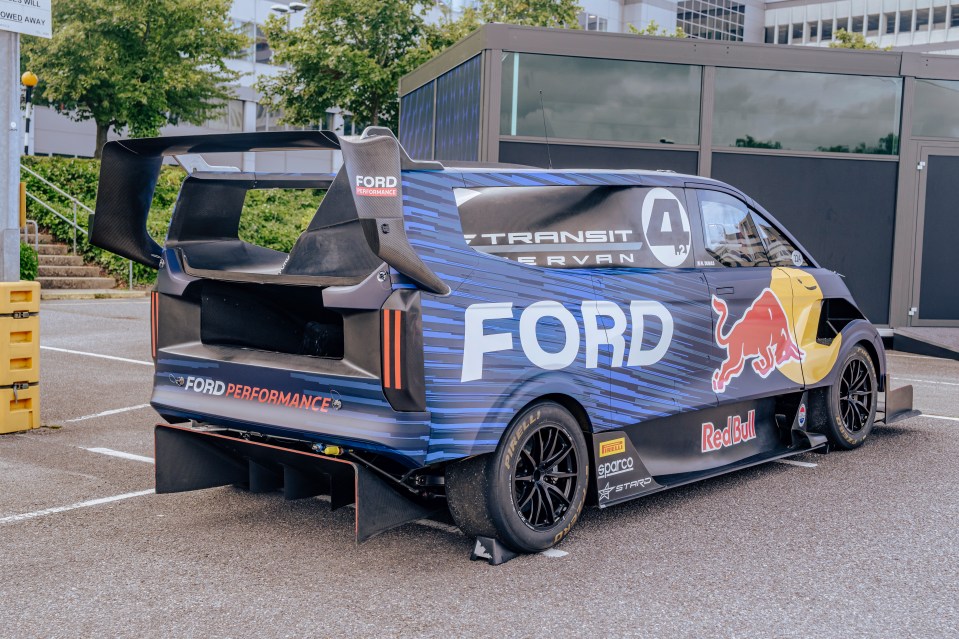 a ford transit van is parked in a parking lot