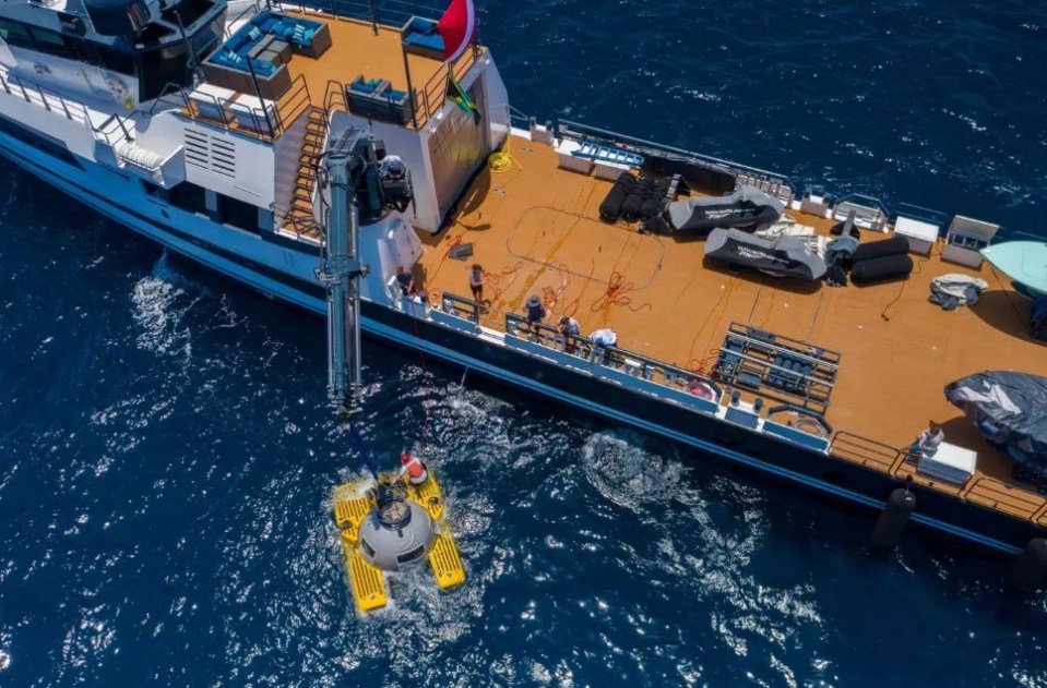 an aerial view of a large yacht in the ocean