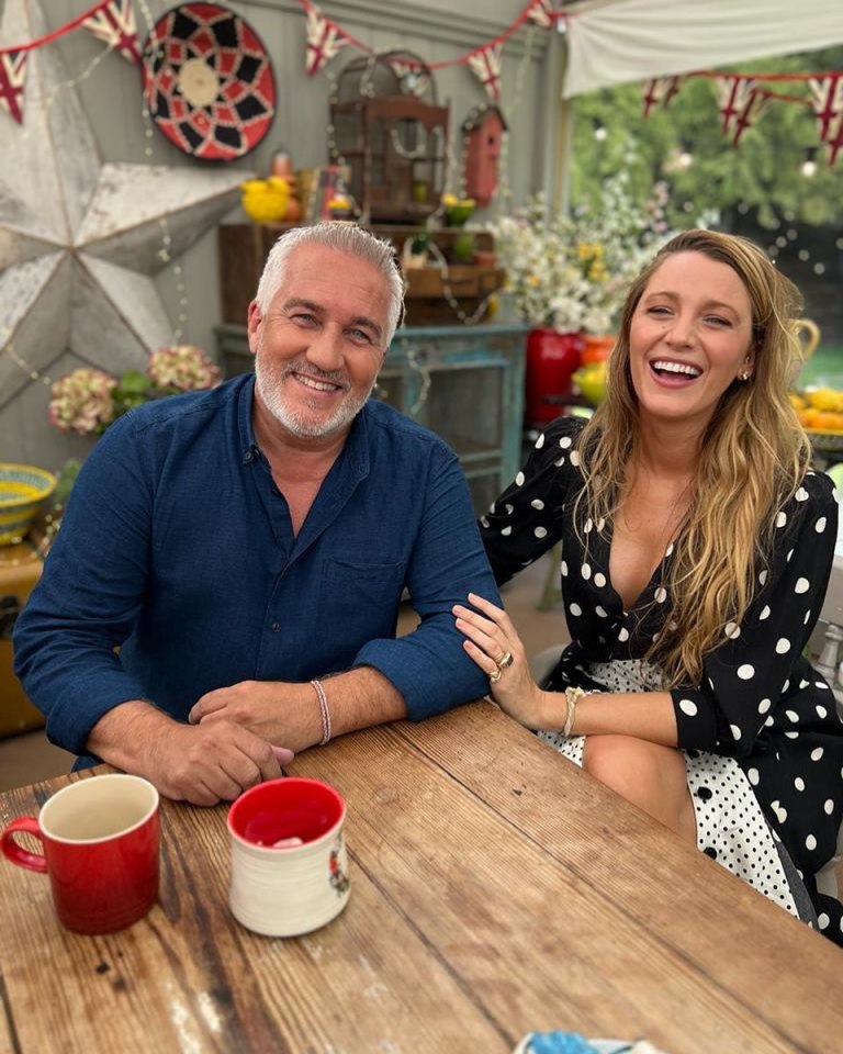 a man and a woman sit at a table smiling