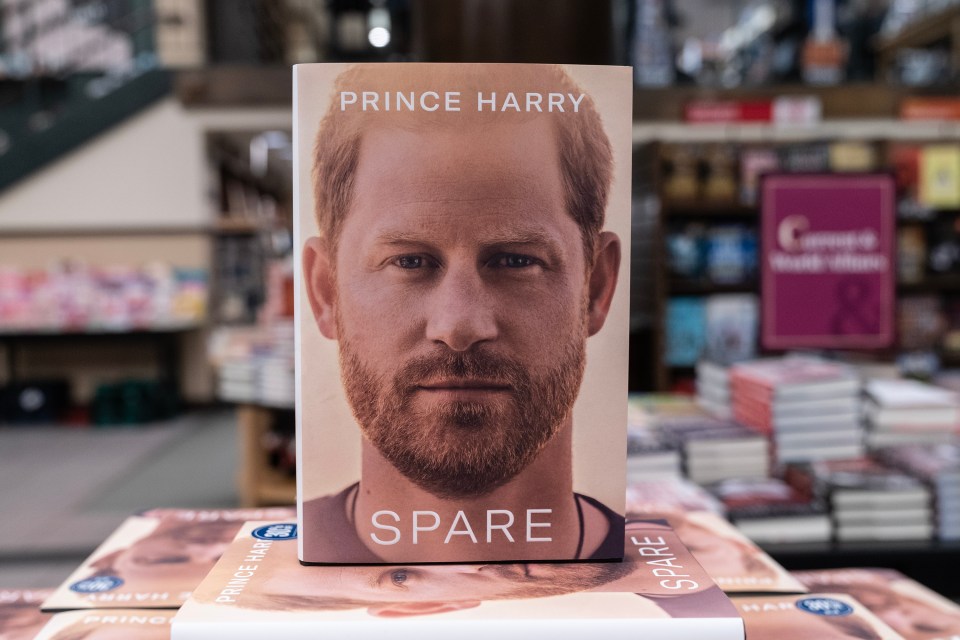 a book by prince harry called spare sits on a table